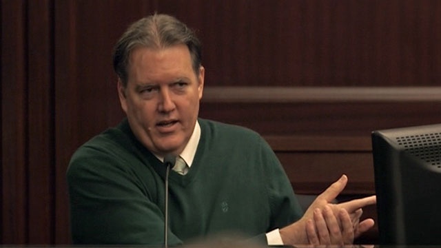 Michael-Dunn-on-stand-pointing