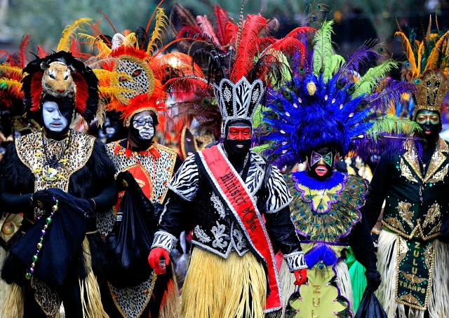 NEW ORLEANS, LA - MARCH 04: Memebers of the Krewe of Zulu parde dispite ther rain Mardi Gras day on March 4, 2014 in New Orleans, Louisiana. Fat Tuesday, the traditional celebration on the day before Ash Wednesday and the begining of Lent, is marked in New Orleans with parades and marches through many neighborhoods in the city.(Photo by Sean Gardner/Getty Images)