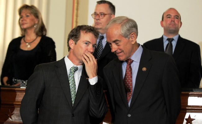 U.S. Sen. Rand Paul (R-KY) (L) talks to his father, former Rep. Ron Paul (R-TX) (R) during a news conference June 22, 2011 on Capitol Hill in Washington, DC. (Alex Wong/Getty Images)