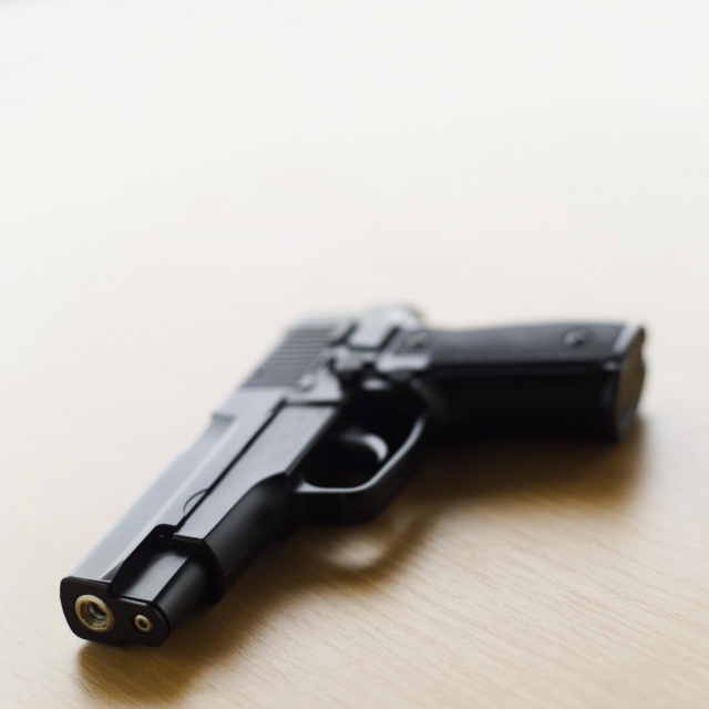 A gun on a table