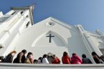 People line up to enter for Sunday service at the Emanuel AME Church.