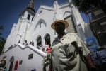A member of the church is seen outside of Emanuel AME before its first service since the Charleston shooting.