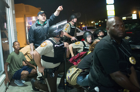 2015: A teen is caught in the crossfire during a shooting that took place in Ferguson on the anniversary of Mike Brown’s death.