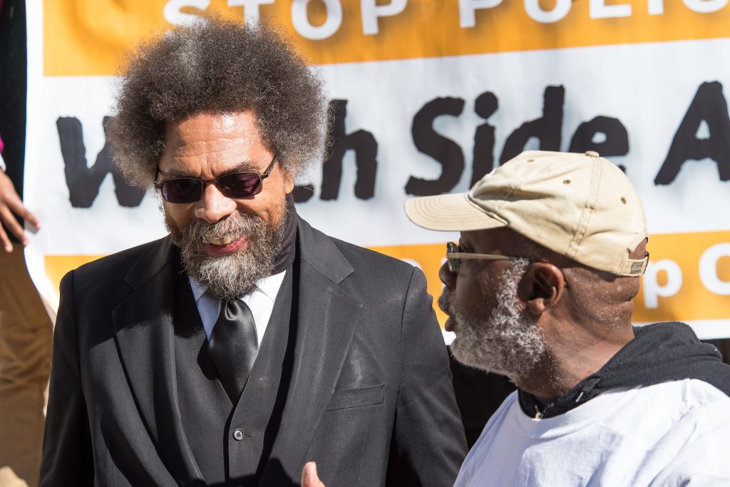 Carl Dix (right) introduces Dr. Cornel West at the press...