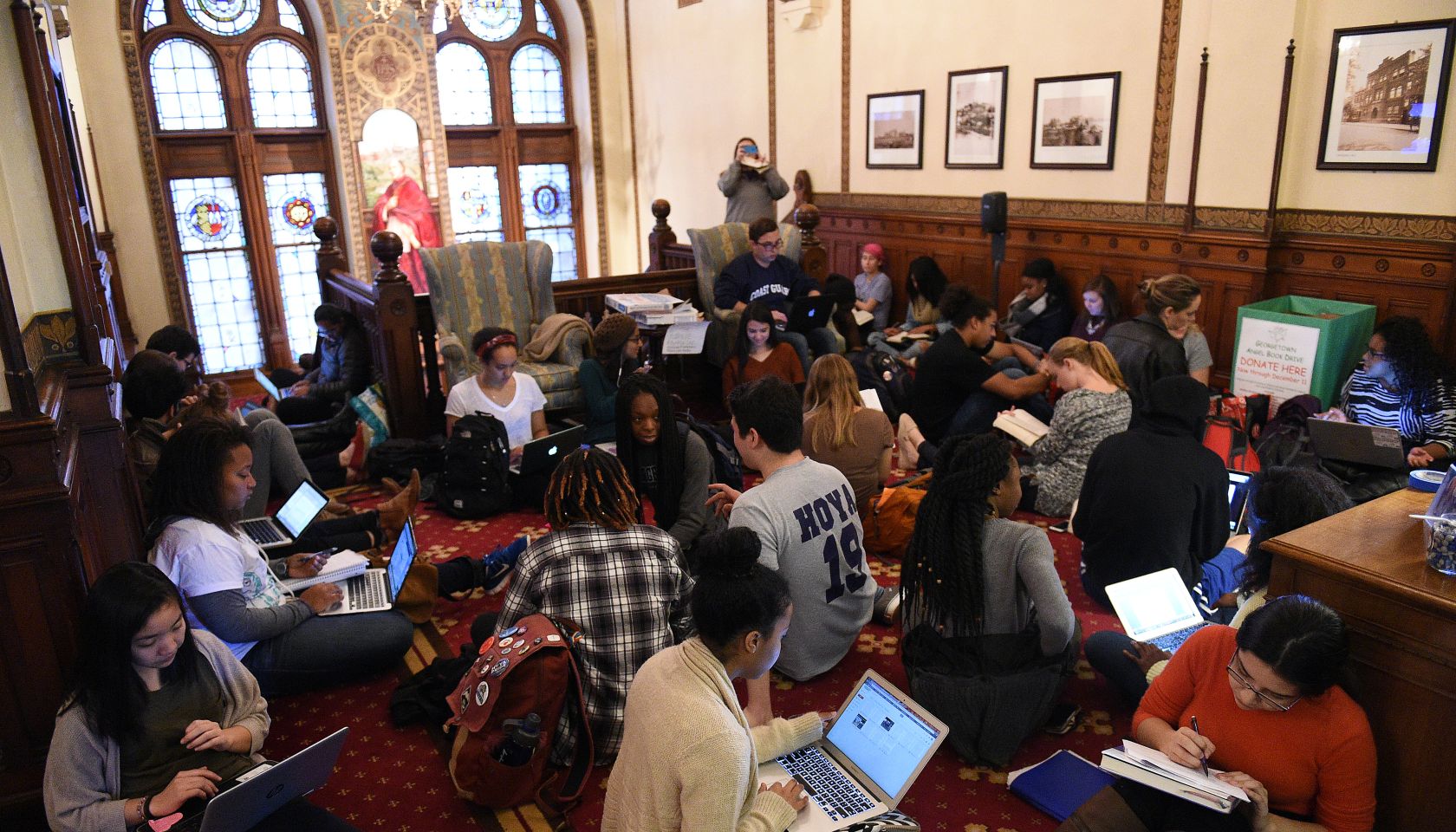 WASHINGTON, DC - NOVEMBER 13: Around 30 students sit in in fron