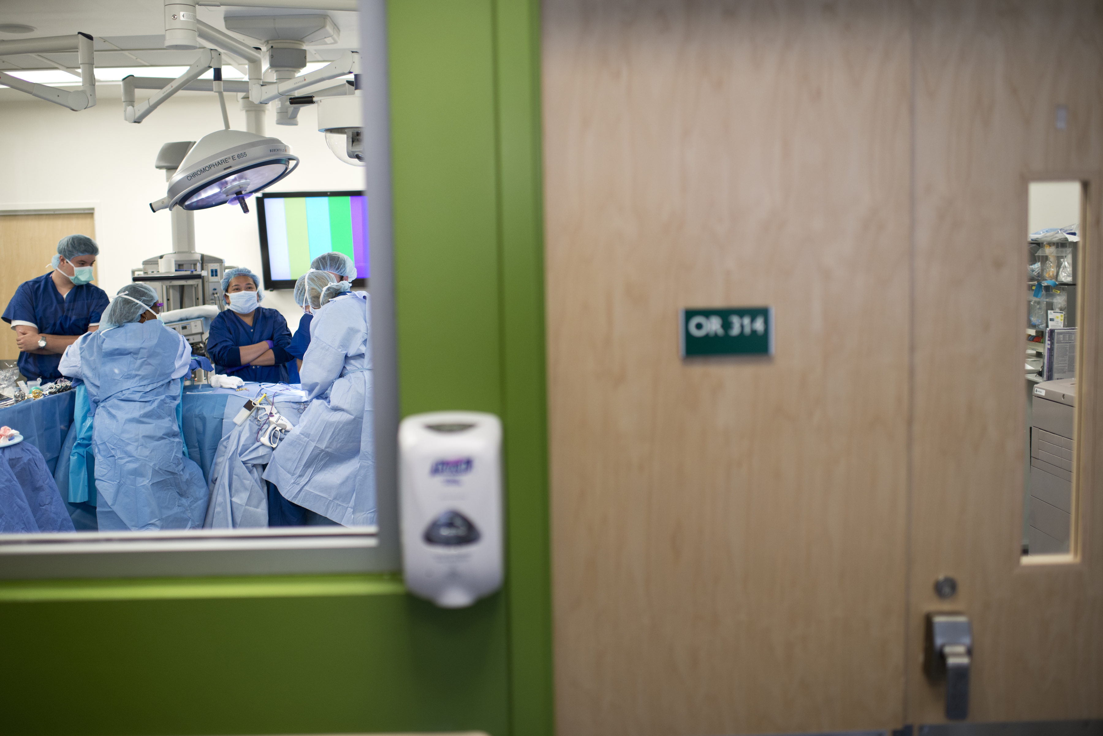 A student and staff watch over a donor d