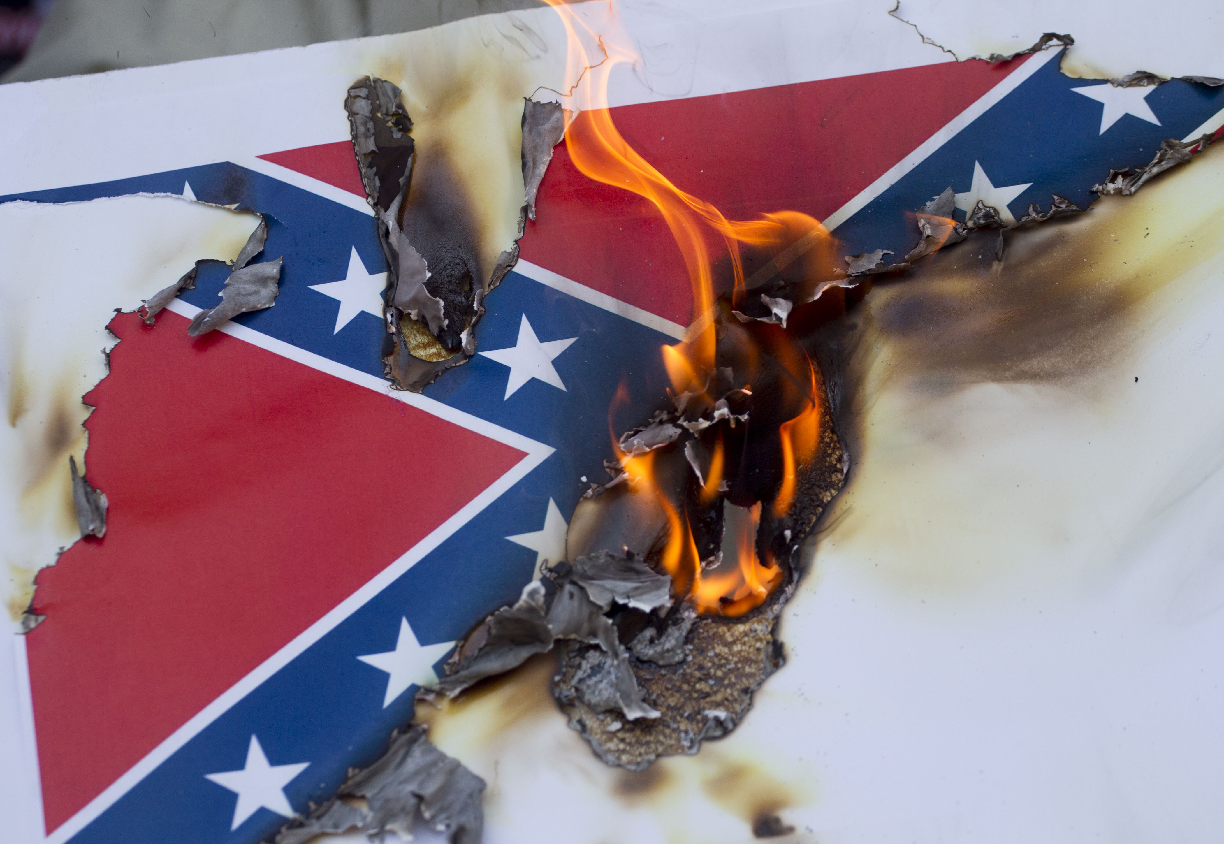 Activists In Los Angeles Gather To Burn Likenesses Of The Confederate Flag
