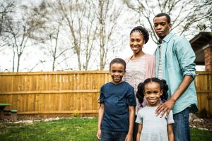 family portrait with new house