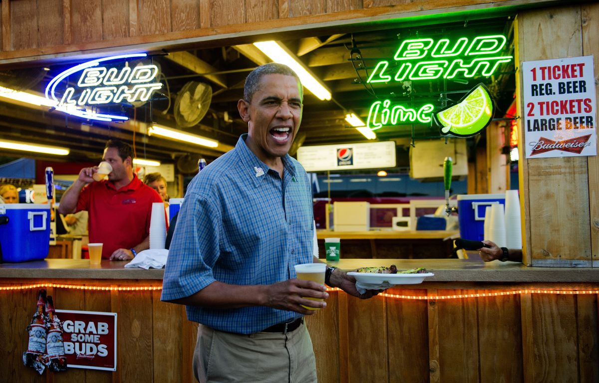 US President Barack Obama (C) gets a bee