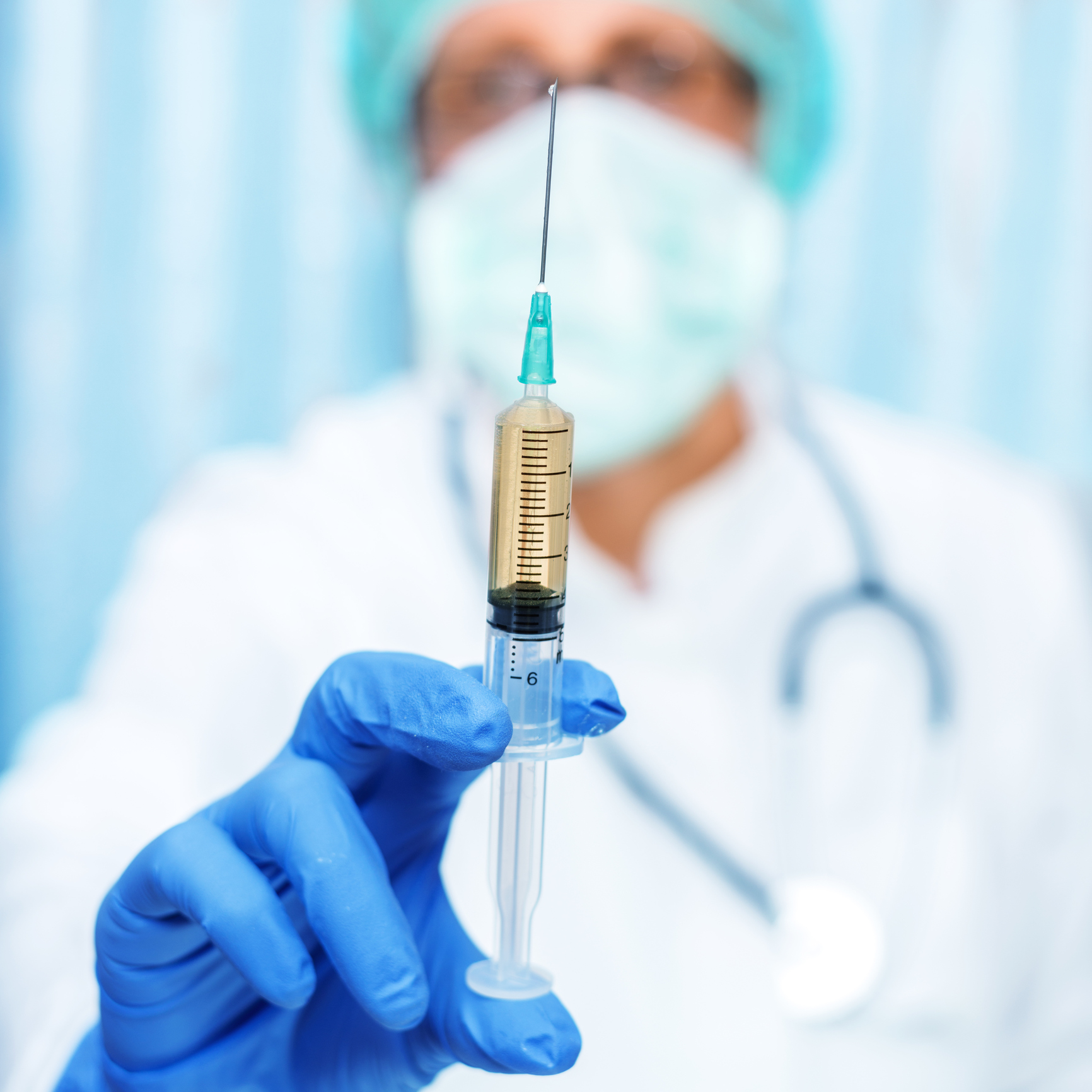 Female doctor with syringe