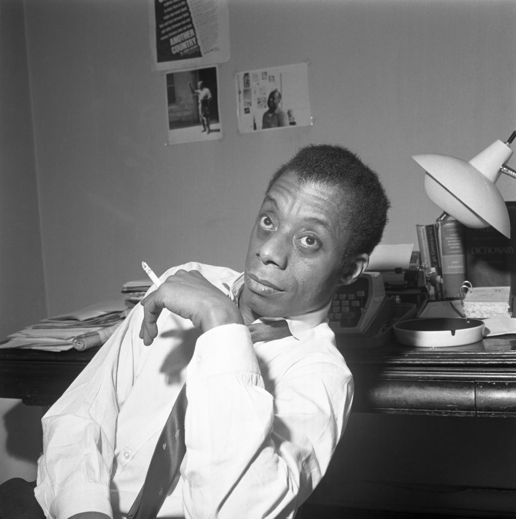 James Baldwin Sitting Smoking A Cigarette