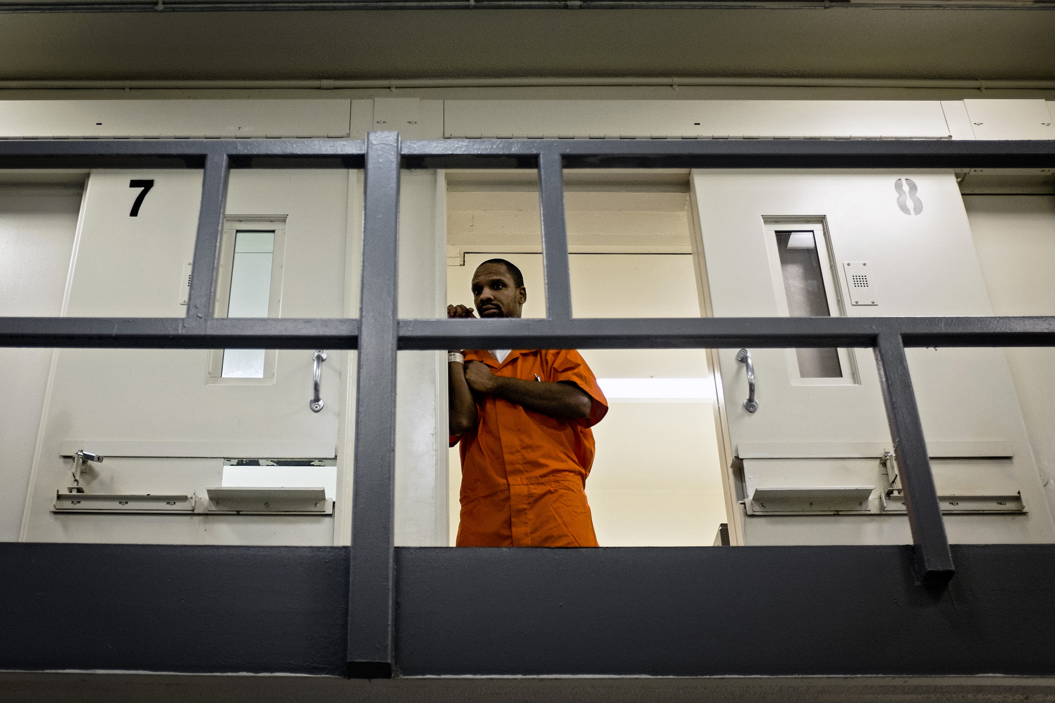 An inmate watches from his cell as DC Mayor Muriel Bowser tours DC Central Jail after announcing policy changes to support employment for inmates during and after incarceration in Washington...