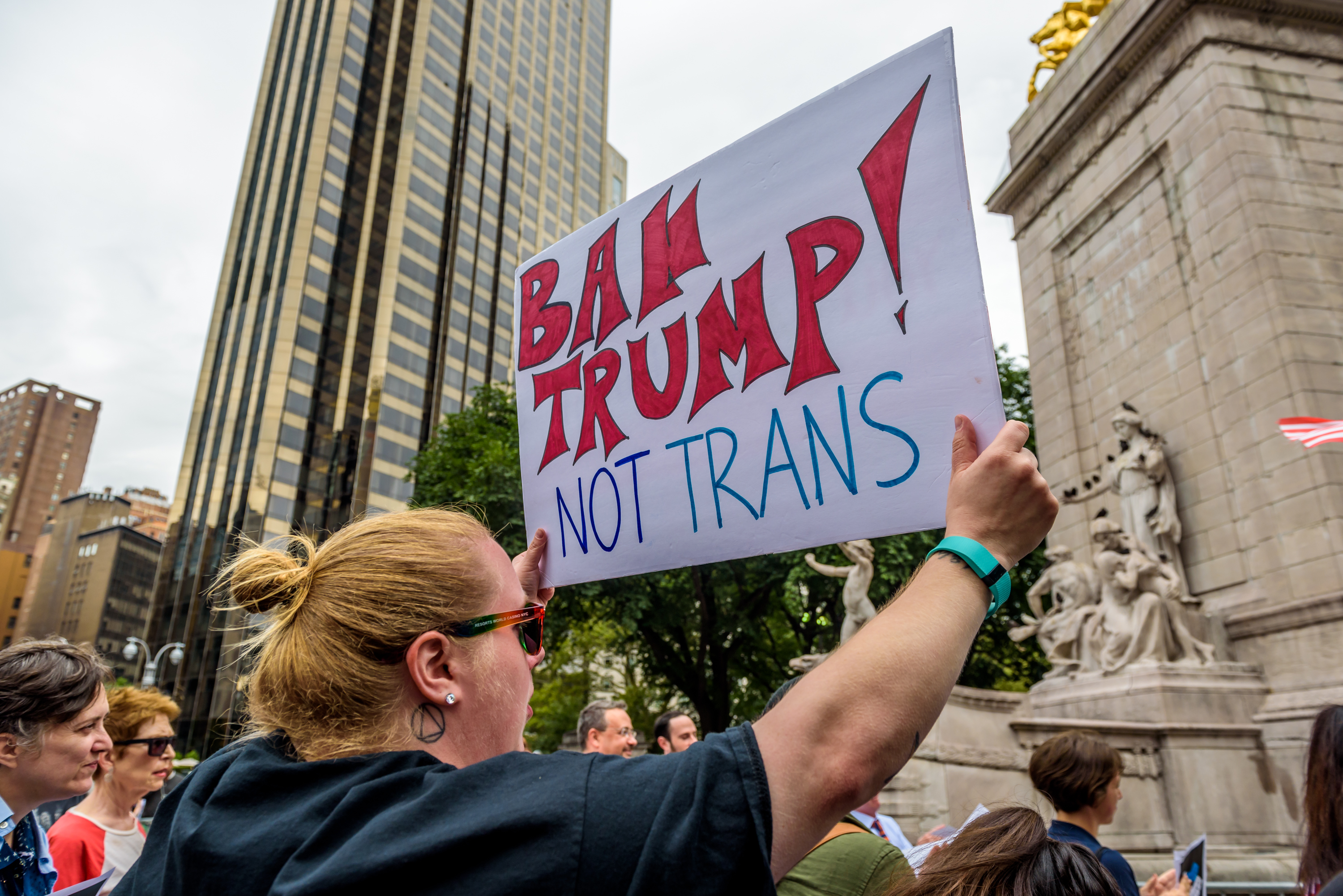 A group of New Yorkers gathered at Columbus Circle across...
