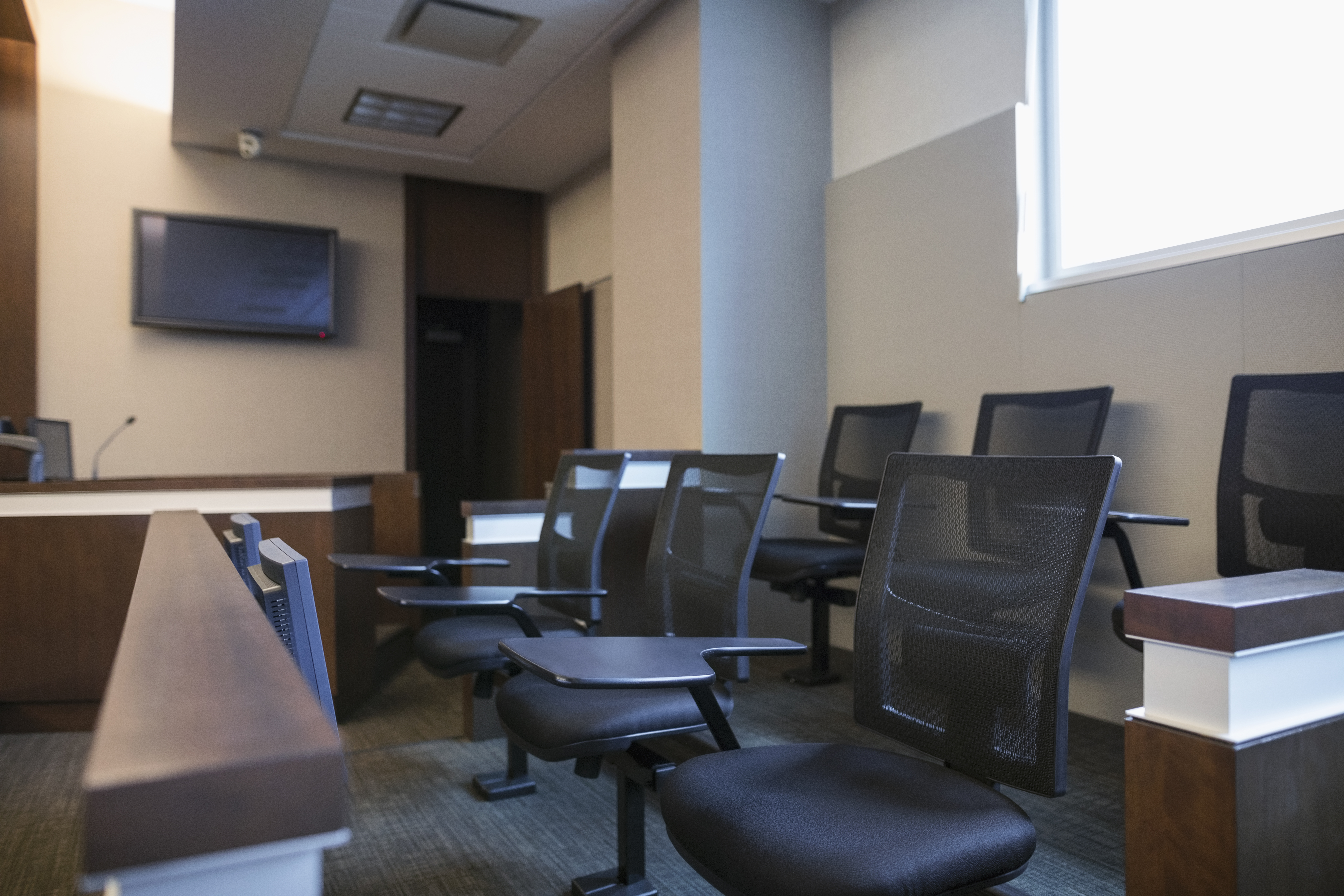 Jury box seats in empty courtroom