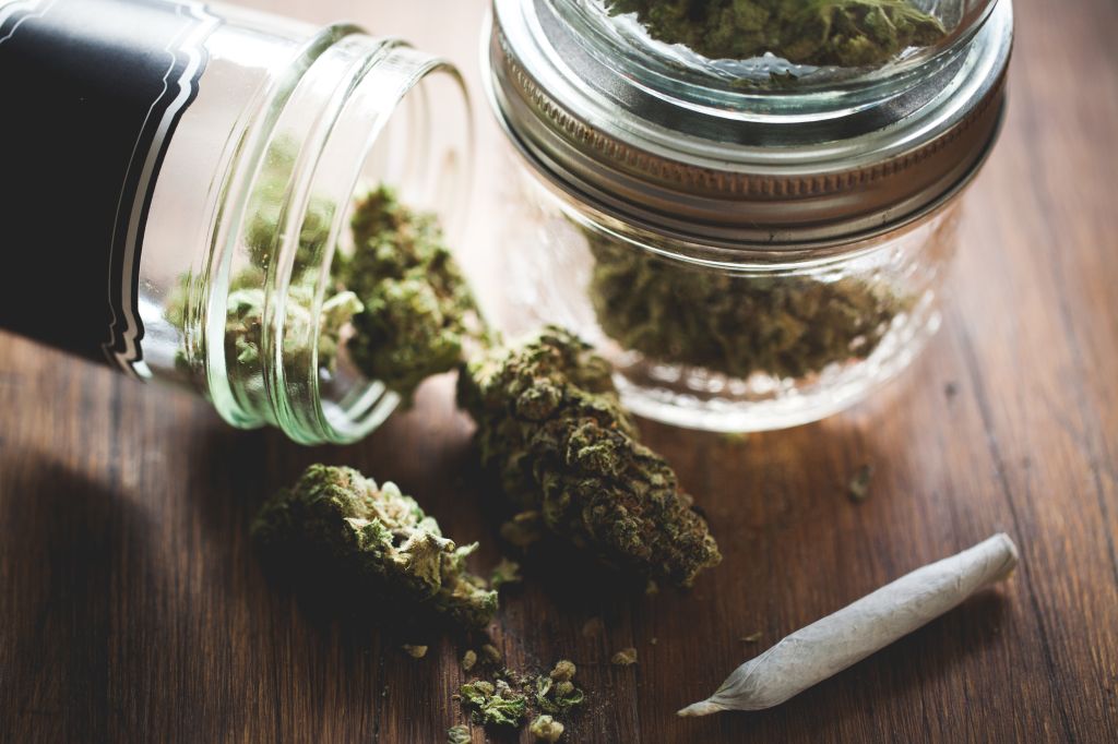 Marijuana in a jar. Cannabis joint. Medical or recreative