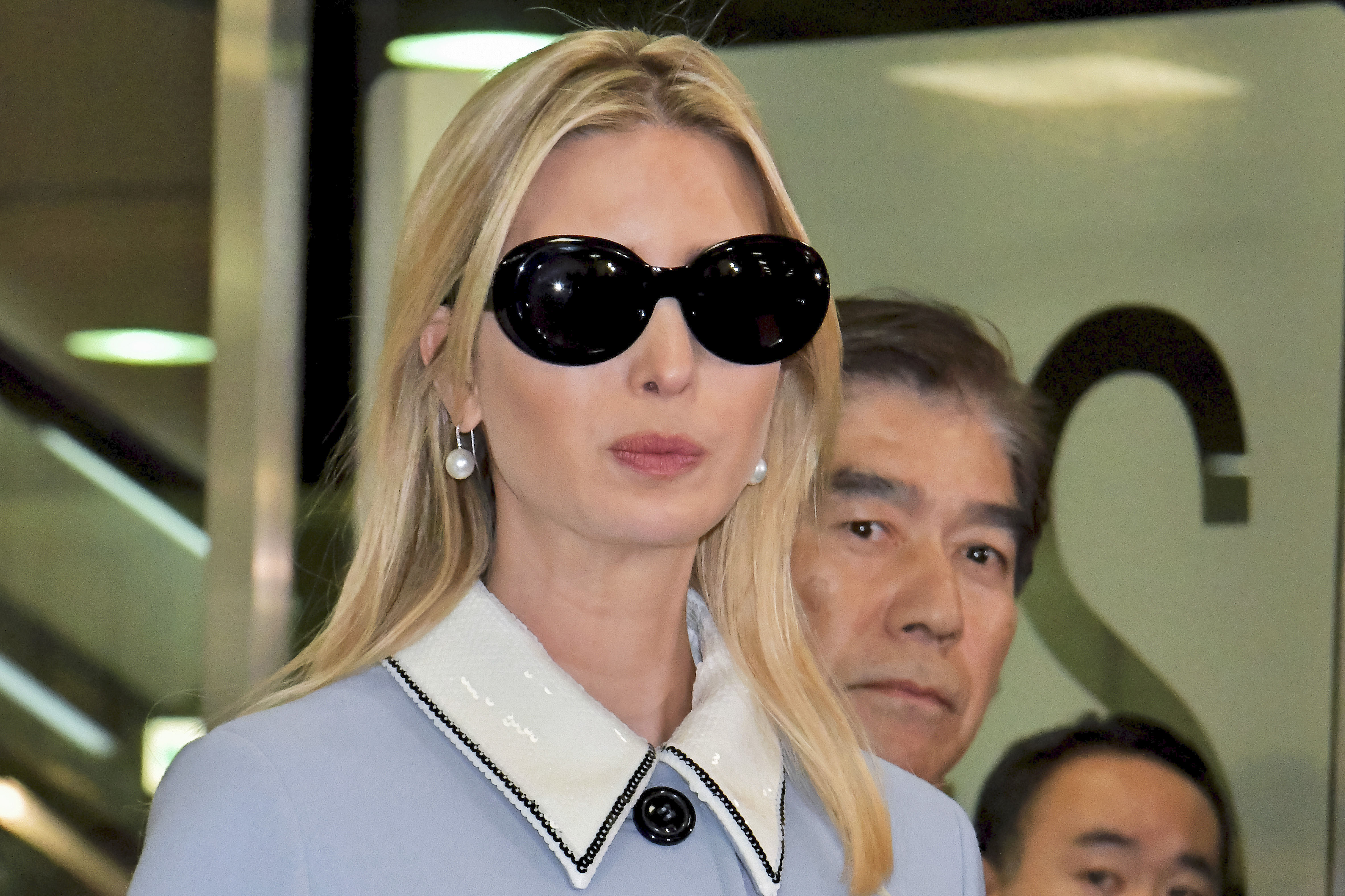 Ivanka Trump and William F. Hagerty arrive at Narita International Airport