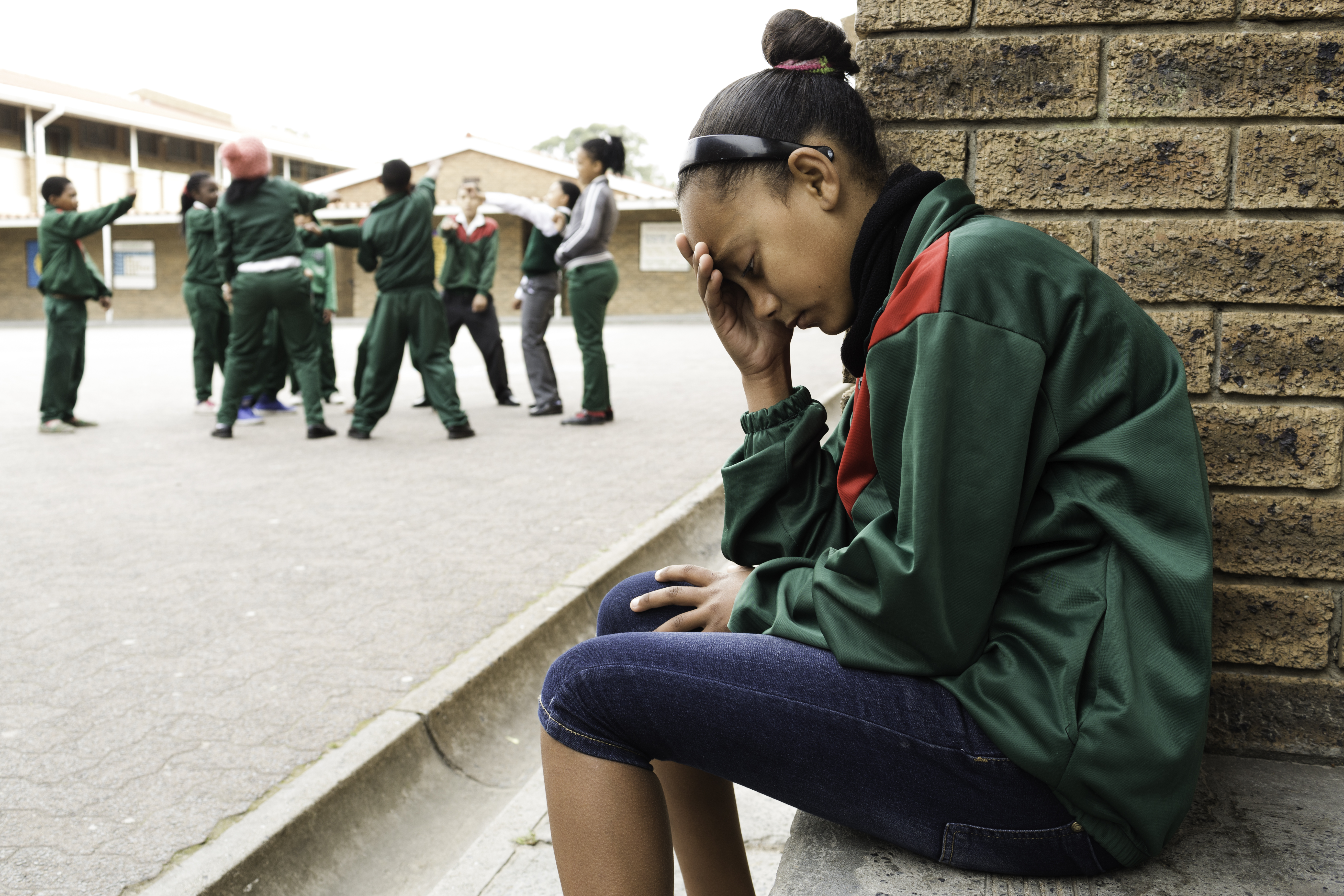 Sad schoolgirl on her own