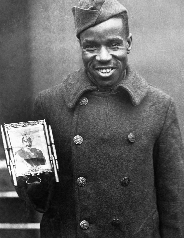 Corporal Holds Good Luck Picture