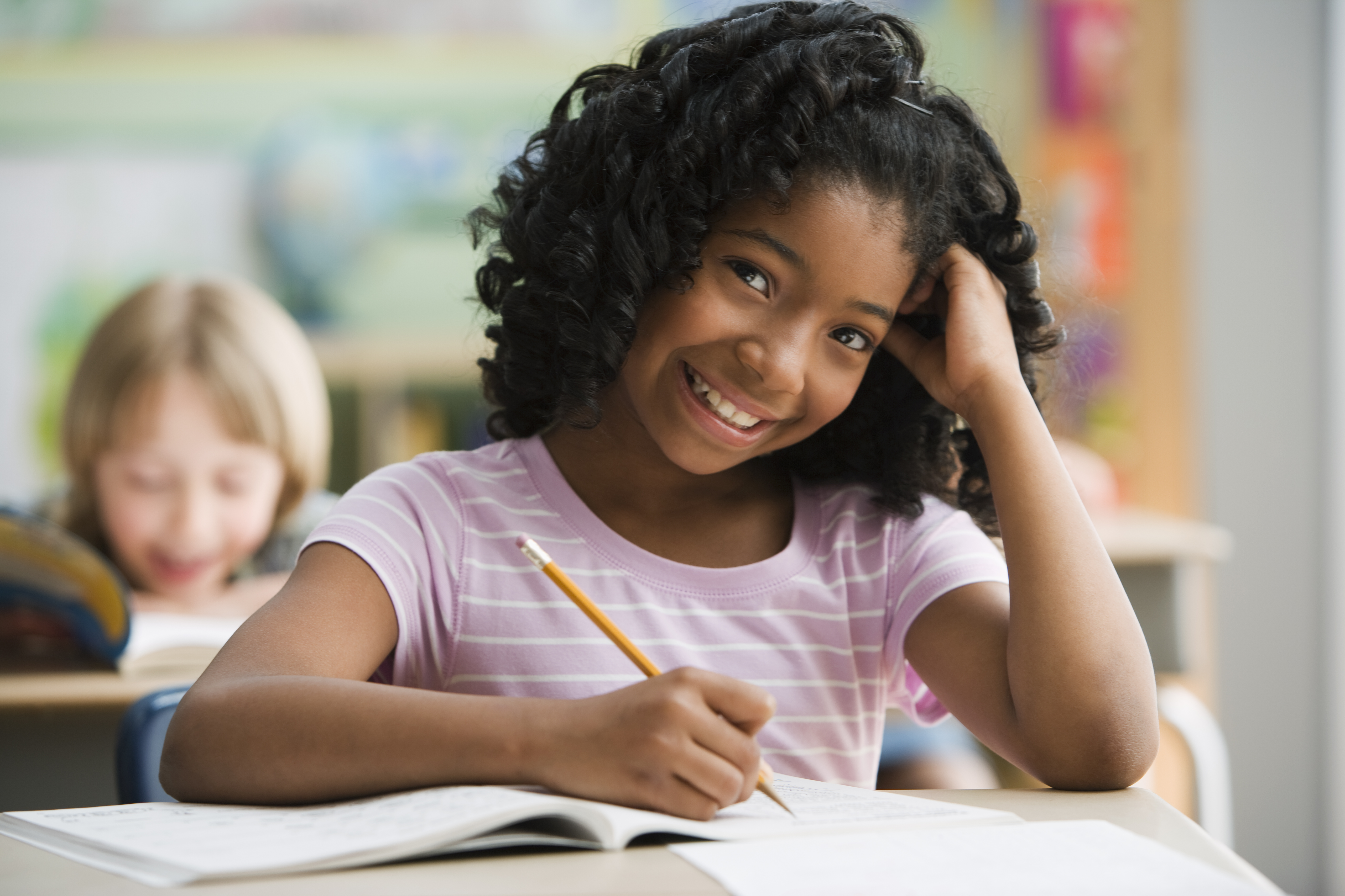 Portrait of a young female student studying in class