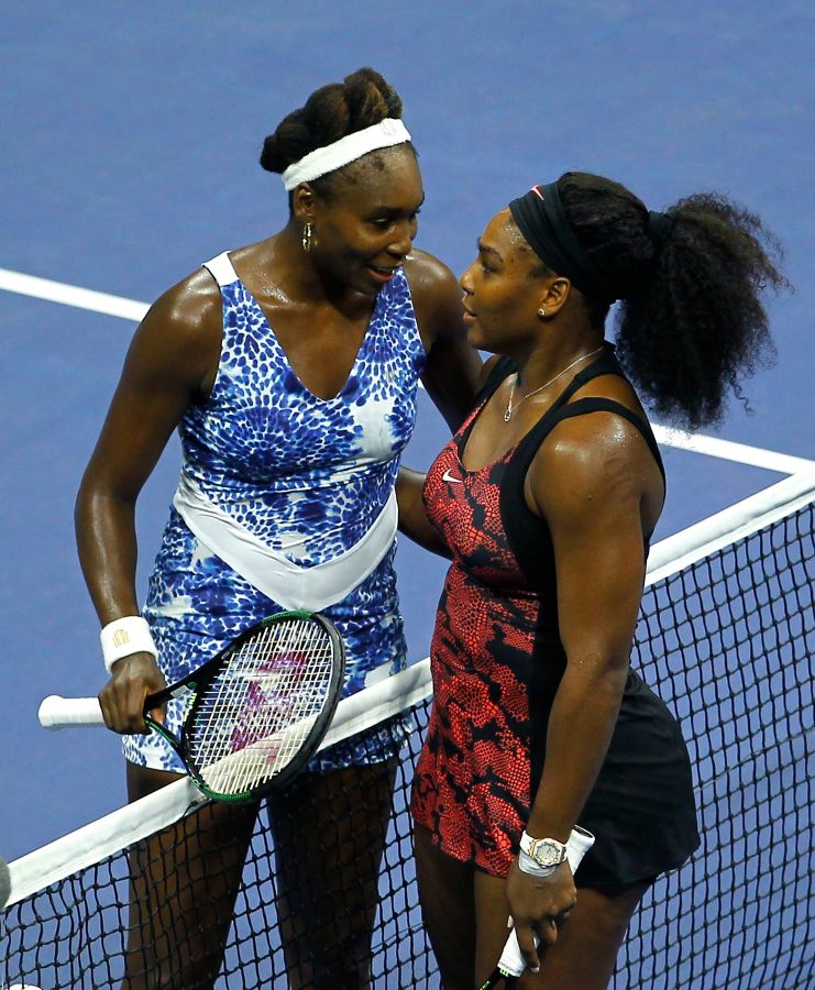 Serena Williams of the U.S. embraces her sister Venus Williams at the net after defeating her in the
