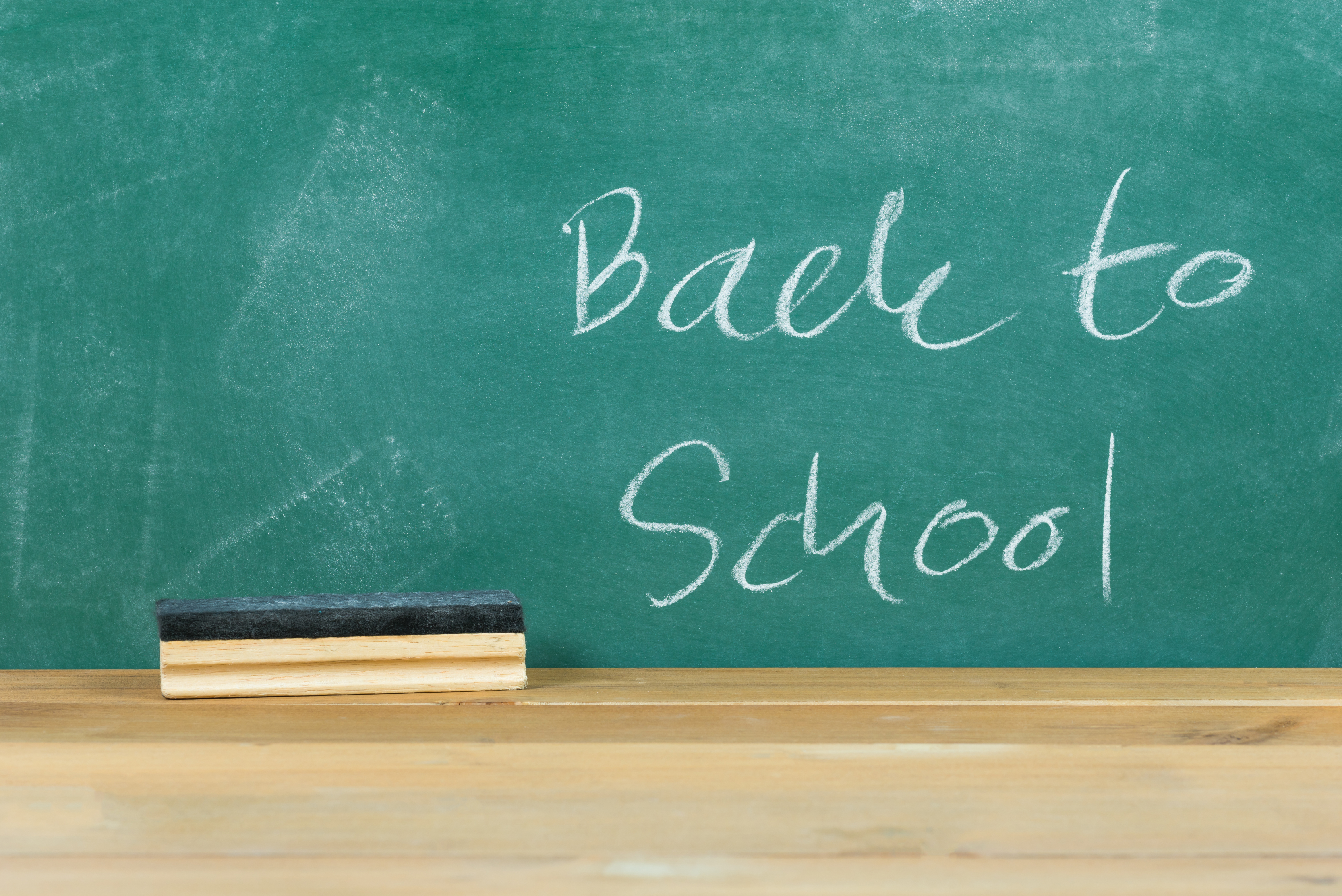 Back To School Text On Blackboard In Classroom