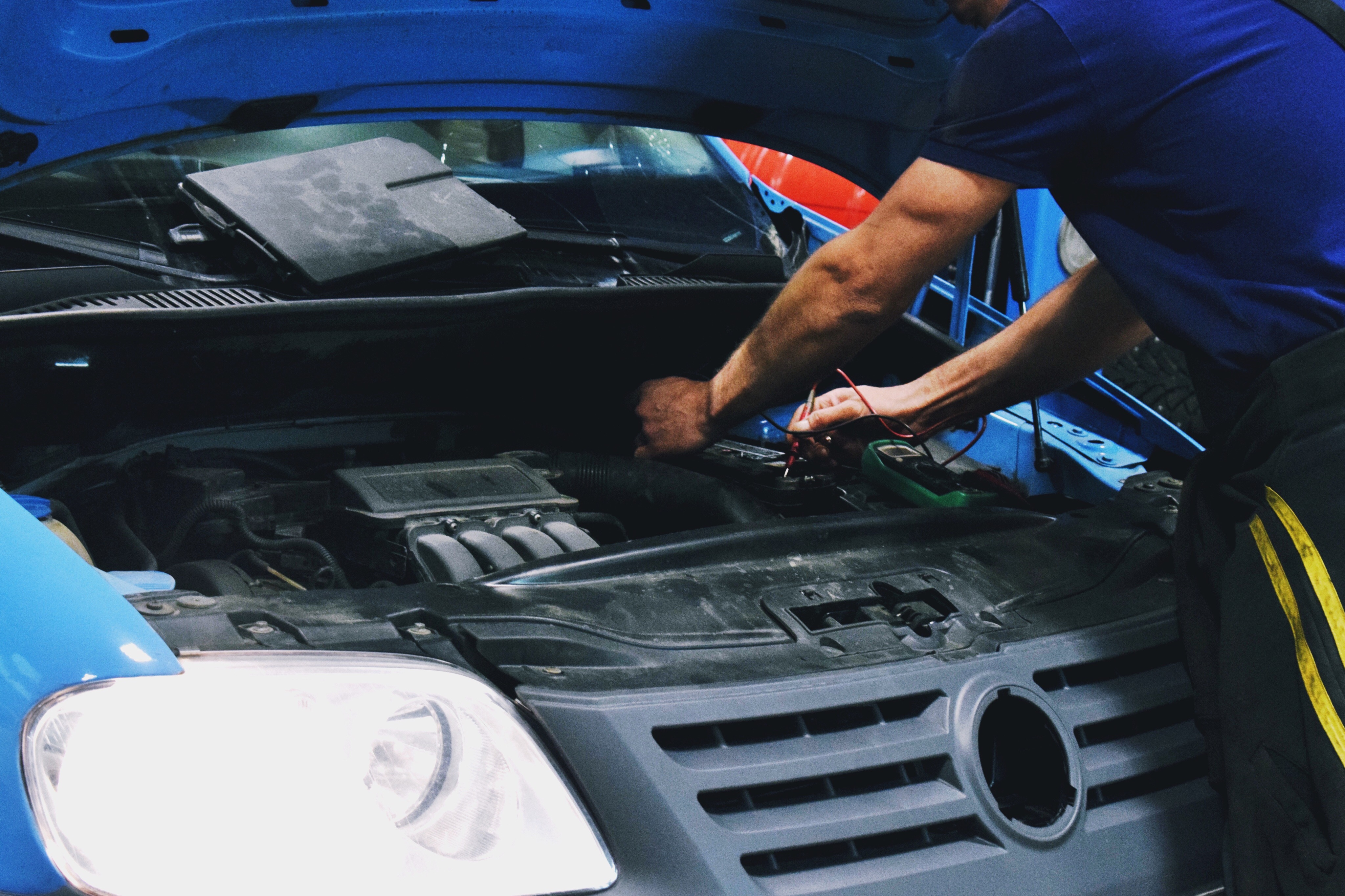 Midsection Of Man Repairing Car