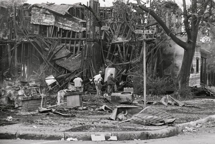 Men Searching Wreckage of Burned Building