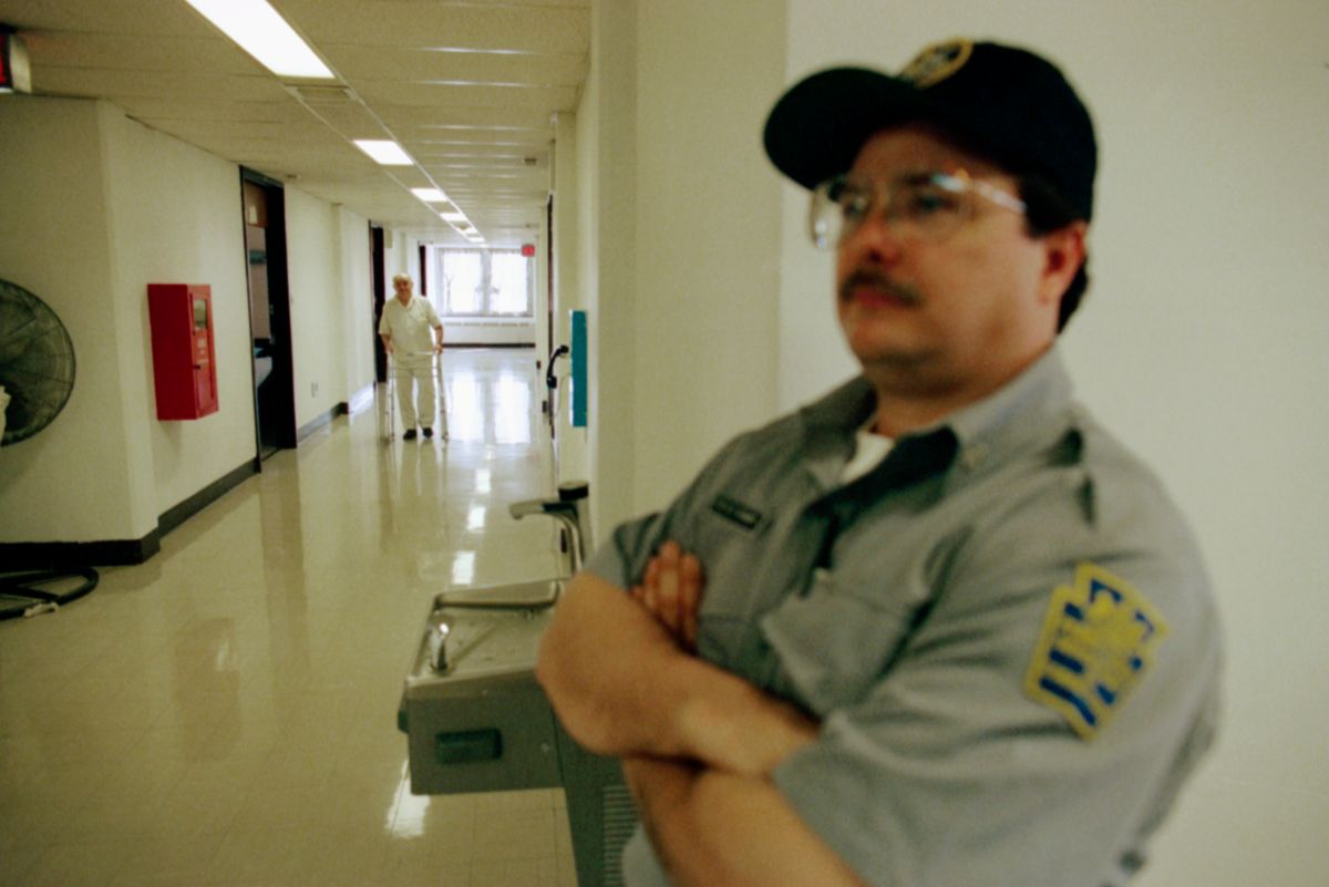 Prison Guard in Hallway