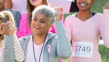 Senior breast cancer survivor during charity event
