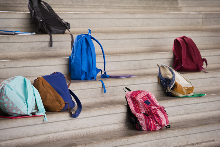 Backpacks left on bleachers