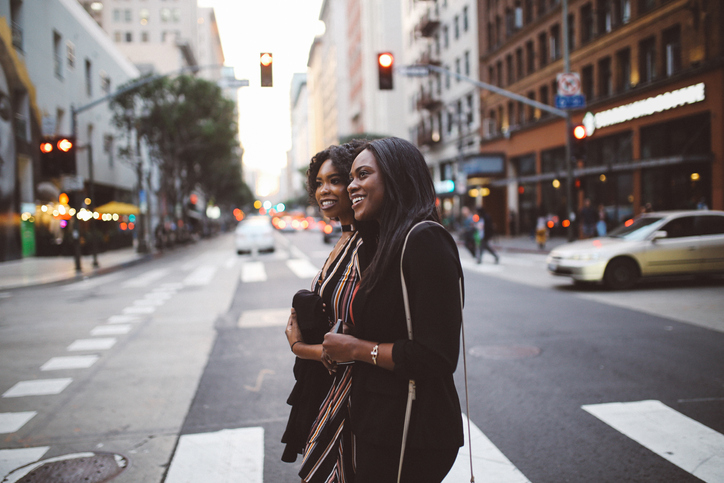 Two young female friends talking in downtown LA