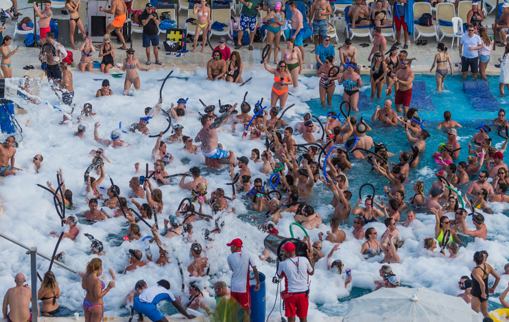 Adults enjoying pool party at hotel resort in Dominican Republic