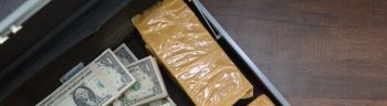 Drug and Dollar Money in suitcase, Drug trafficking, crime.