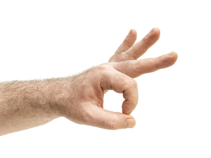 Cropped Hand Of Man Gesturing Against White Background