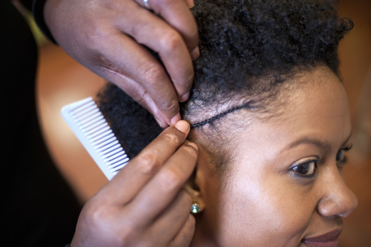 Woman Getting Hair Styled at Salon