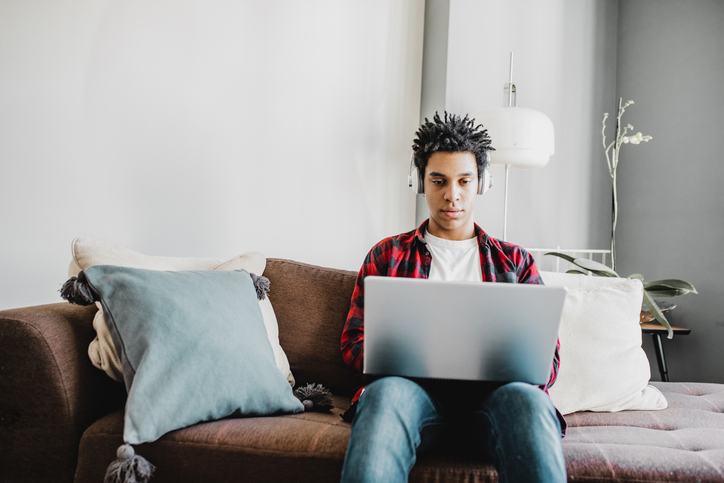 Man using laptop at home