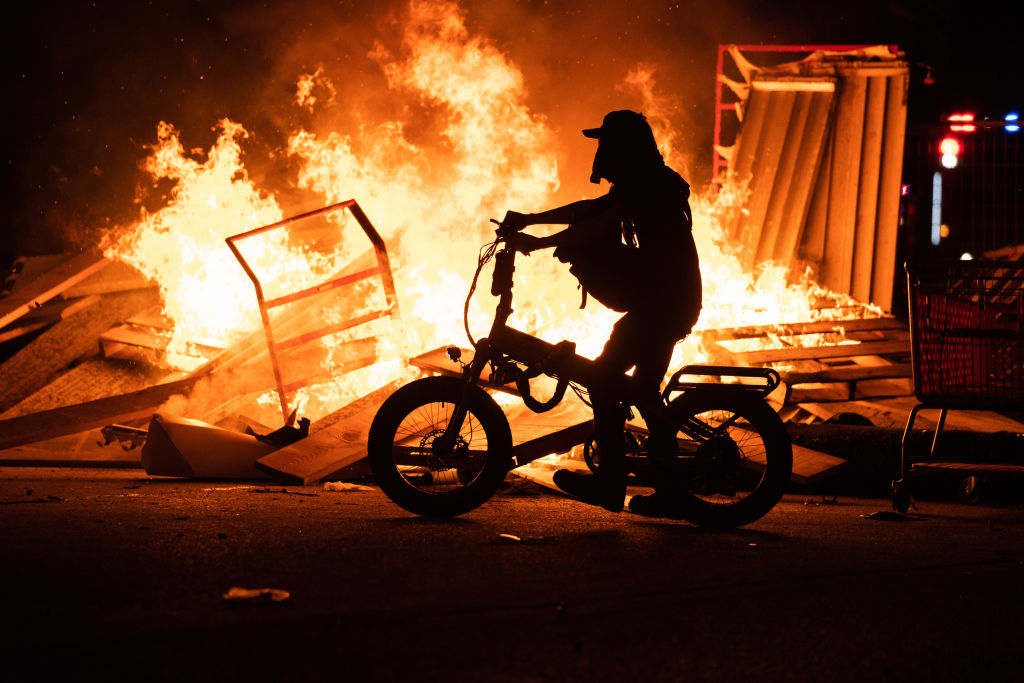 Minnesota community members mourned, protested and looted in reaction to George Floyd dying in police custody