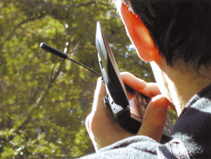 Close up of man holding cell phone