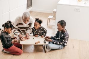 Play dough construction with grandmother and kids