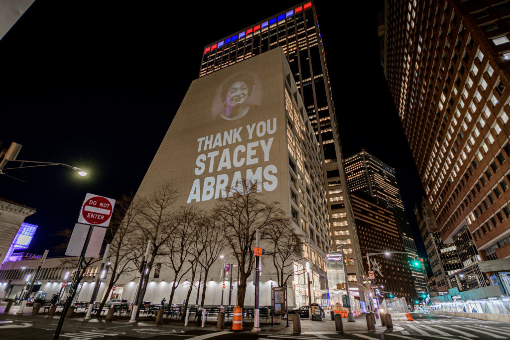 Activists with Rainforest Action Network and The Illuminator...