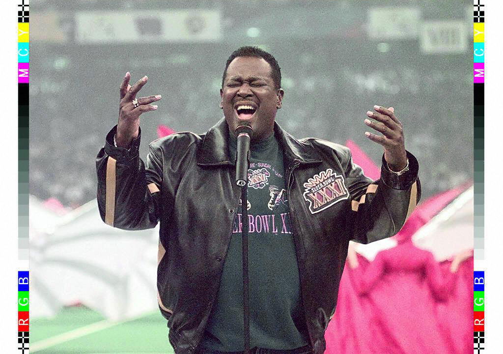 Singer Luther Vandross sings the US National Anthe