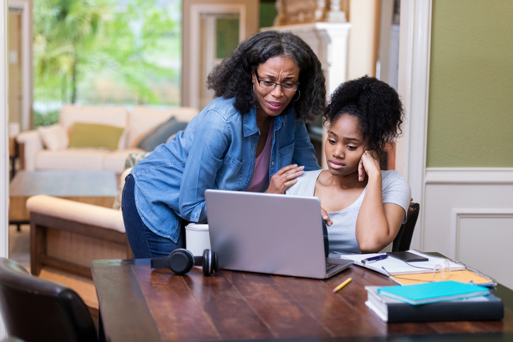 Mature mom comforts upset daughter