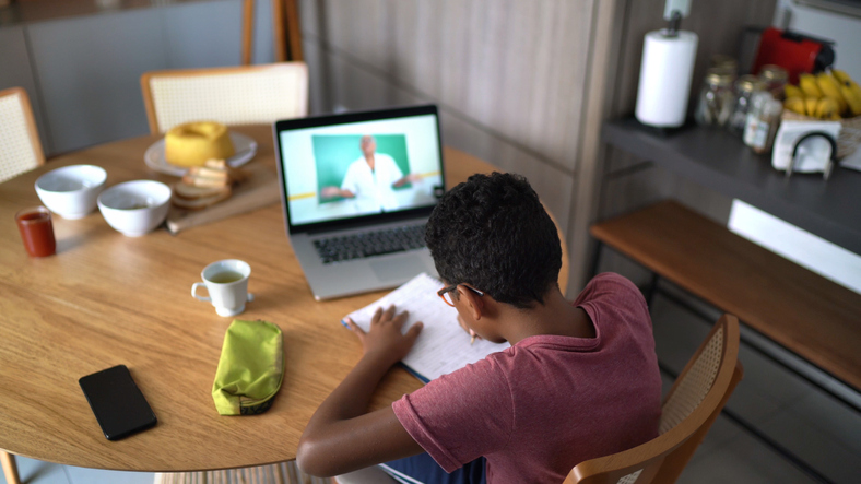 Boy watching video class at home