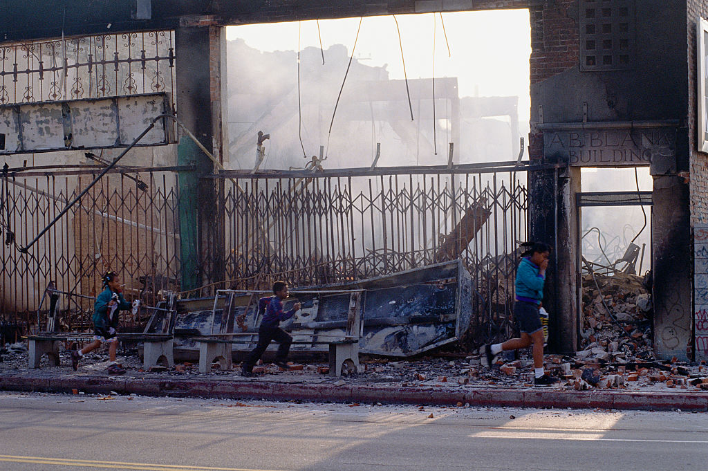 Children Passing Destroyed Building