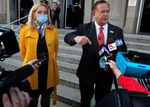 Mark and Patricia McCloskey arrive for court