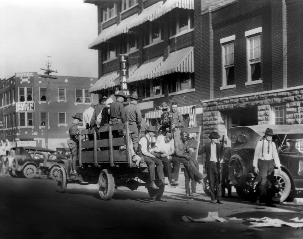Truck on Street near Litan Hotel carrying Soldiers and African Americans during Race Riots, Tulsa, Oklahoma, USA, Alvin C. Krupnick Co., June 1921