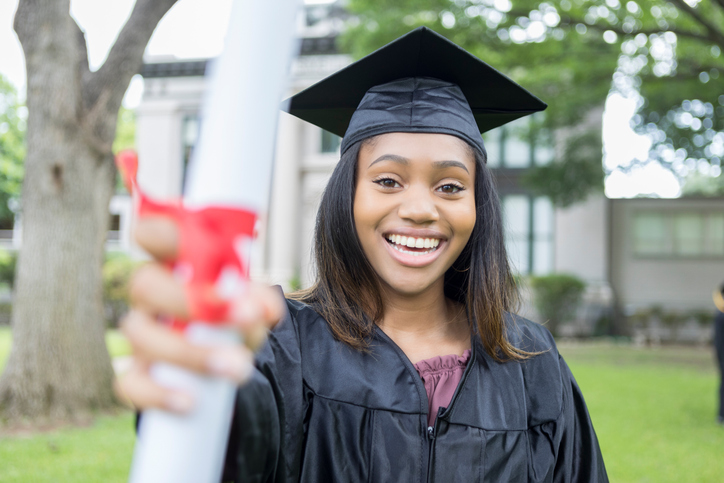 Confident female college graduate