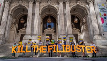 Protesters seen holding a banner reading KILL THE FILIBUSTER...