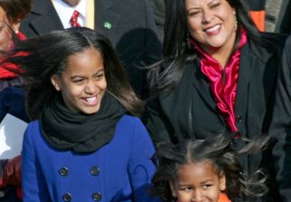 (012009 Washington, DC) Malia, 10, and Sasha Obama, 7, wait for their dad to enter for his inauguration, Tuesday, January 20, 2009. Photo by Angela Rowlings.
