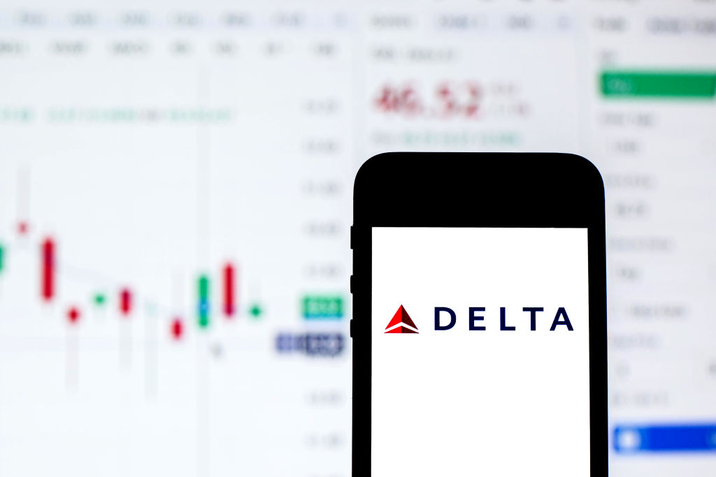 In this photo illustration a Delta Air Lines logo seen...
